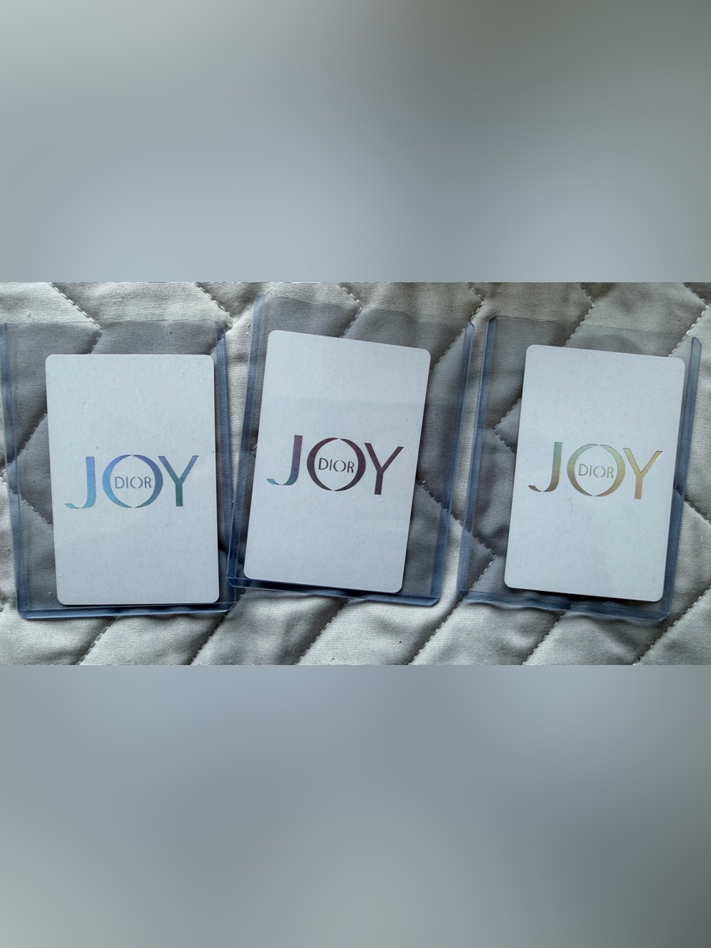3 Dior JOY Holiday Card Trio - Blue, Mauve, and Gold Logos